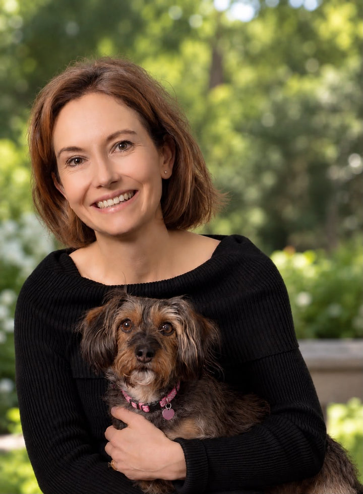 Lilly Shepherd, vet and co-founder of Best Friend Club, holding her dog